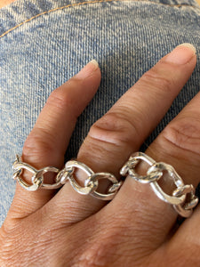 A loose ring in a handmade curbed link in silver
